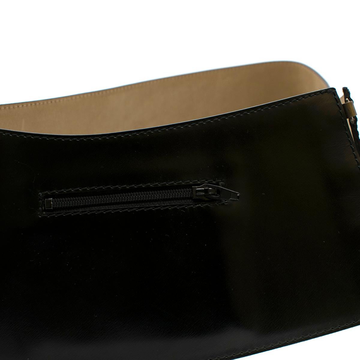 Alaia Black Wide Leather Waist Belt

- Black, wide leather waist belt
- Centre-front hook-and-eye fastening
- Front left side zip pocket
- Beige nubuck lining

Please note, these items are pre-owned and may show some signs of storage, even when
