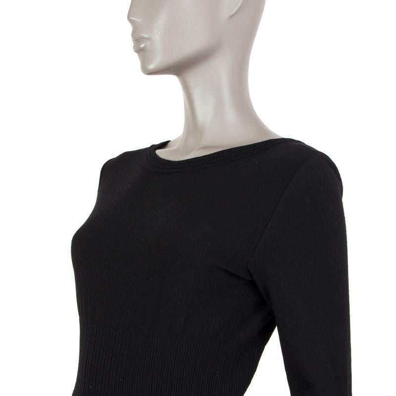 Alaia long-sleeve flared dress in black virgin wool (74%); nylon (20%) and elastodiene (6%). With v back and ruffled hemline. Closes with invisible zipper on the back. Unlined. Has been worn and is in excellent condition. 

Tag Size 38
Size