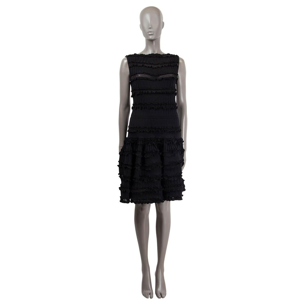 100% authentic Alaïa sleeveless flared dress in black wool (69%), polyamide (17%) and cotton (11%). Features ruffled hemline. Opens with concealed zipper on the side. Unlined. Has been worn and is in excellent condition.

Measurements
Tag