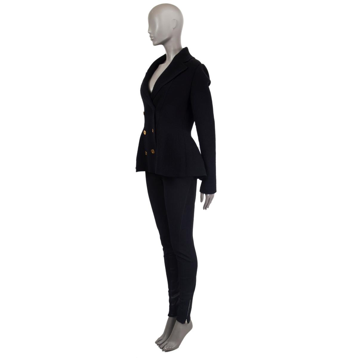 Alexander McQueen double-breasted peplum blazer in black wool (78%), cashmere (20%), nylon (1%) and elastane (1%).  Has antique gold-tone buttons. Unlined. Has been worn and is in excellent condition.

Tag Size M
Size M
Shoulder Width 39cm