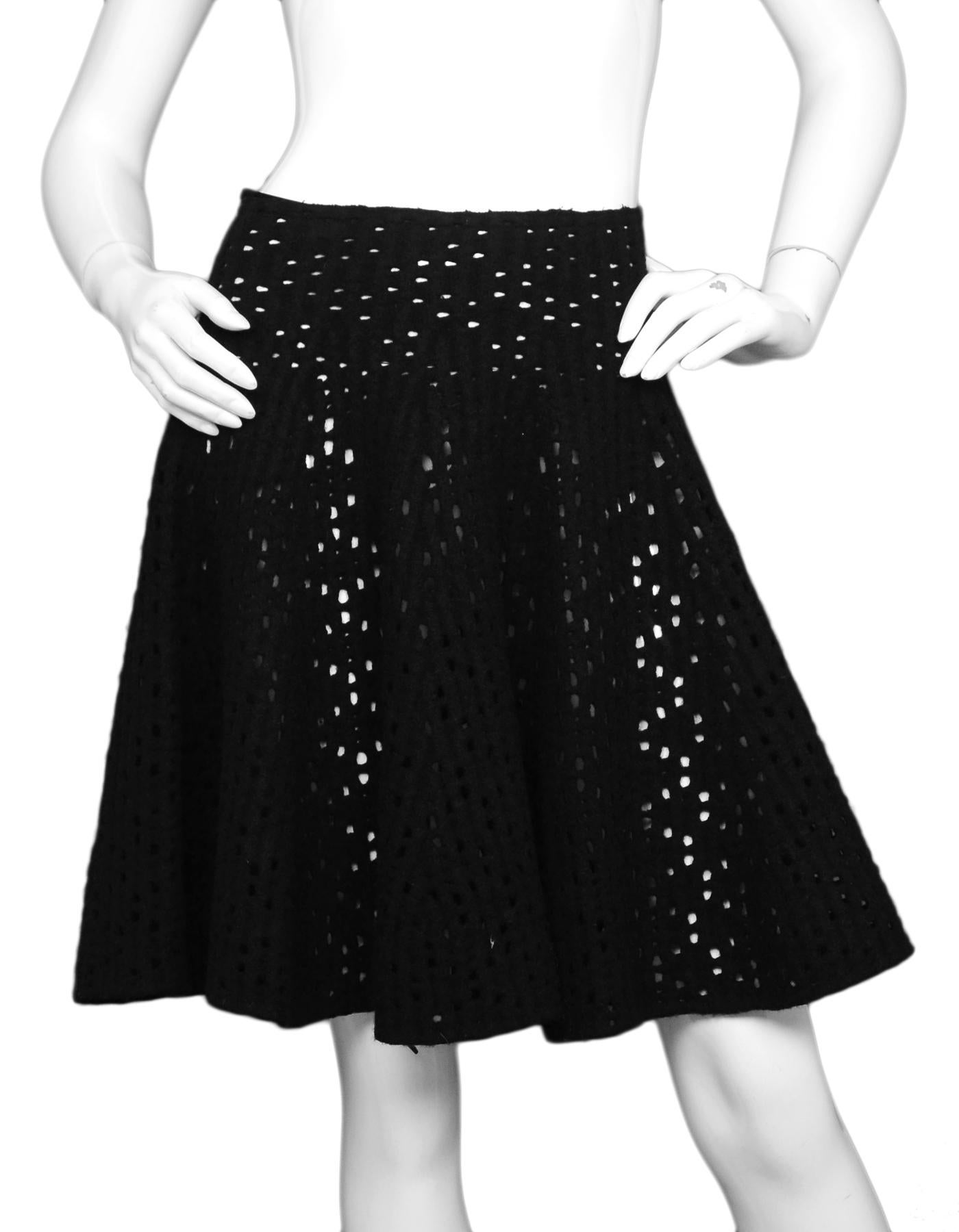 Alaia Black Wool Eyelet Flare Skirt Sz IT 42

Made In:  Italy
Color: Black
Materials: 65% wool, 35% nylon
Lining:  Unlined
Closure/Opening: Hidden back zipper
Overall Condition: Excellent pre-owned condition, unlined (no slip)

Measurements: 
Waist: