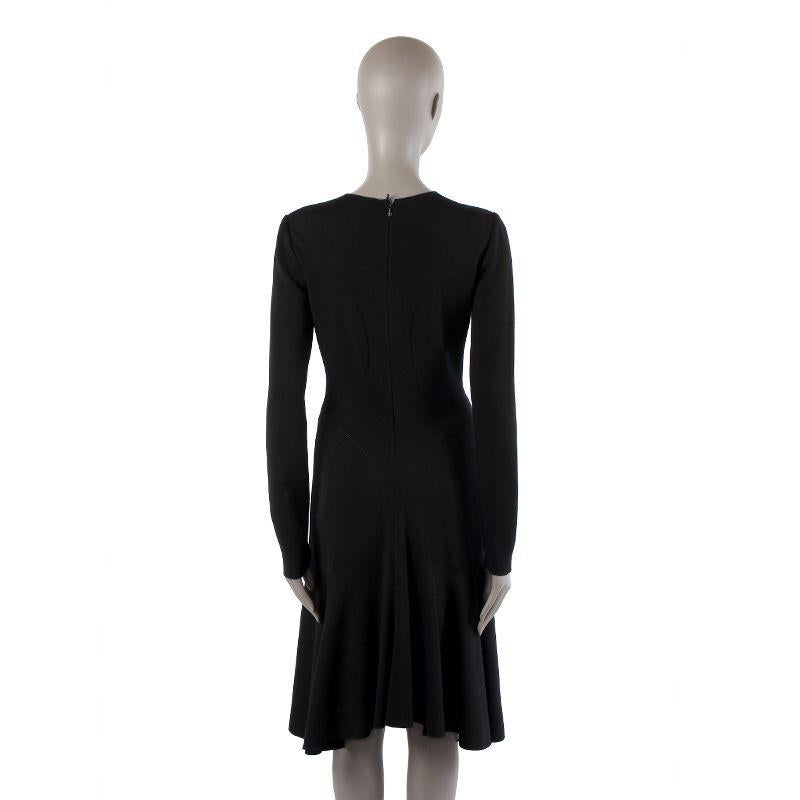 Alaia long-sleeve dress in black virgin wool (100%). With flared hemline. Closes with invisible back zipper. Unlined. Has been worn and is in excellent condition.

Tag Size L
Size L
Shoulder Width 41cm (16in)
Bust 84cm (32.8in) to 96cm