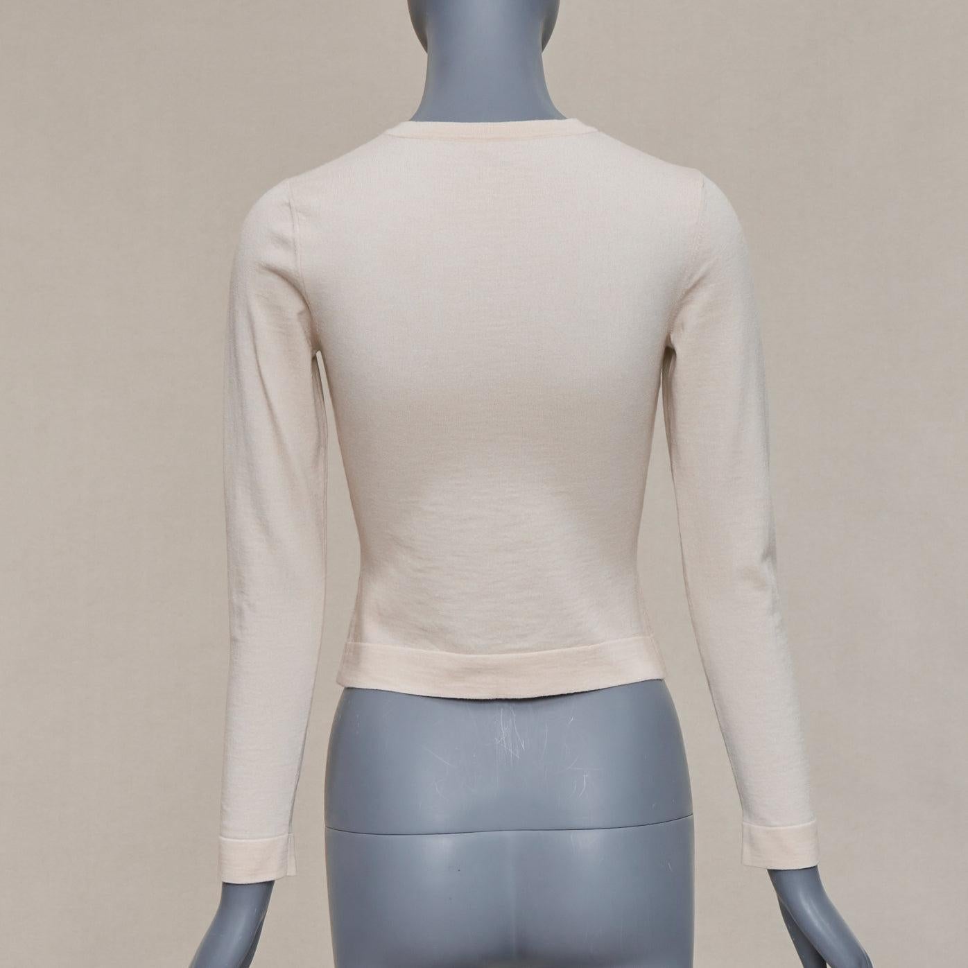 ALAIA blush beige mezcla de lana virgen mini botones chaqueta de punto clásica FR36 S en venta 1