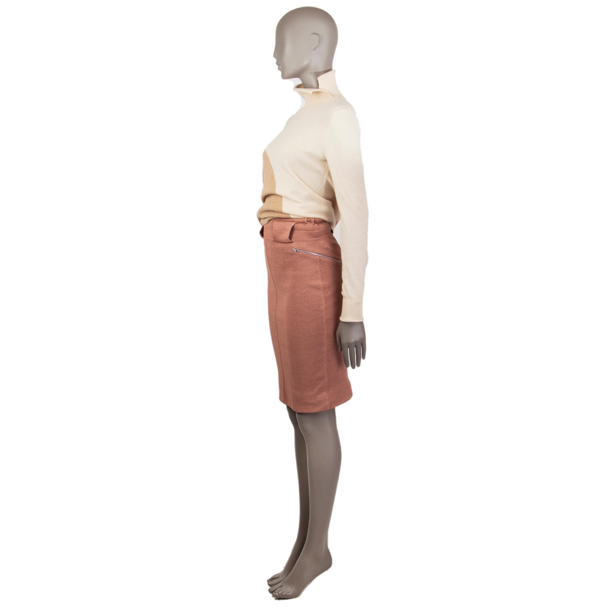 Alaia pencil skirt in light brick linen (72%) polyamide (28%) with an elastic band at the waist detailed with amplified belt loops, two zippers on the sides. Is a slip on skirt with a close-fitting. Has been worn and is in excellent condition.

Tag
