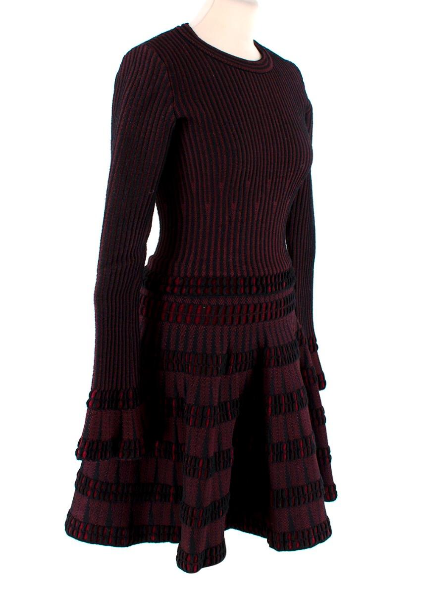 Alaia Burgundy & Black Stretch Knitted Top & Mini Skirt Set
 

 - Top & skirt set rendered in signature Alaia textured knit
 - Woven in red and black yarn to create a burgundy weave with plenty of dimenson
 - Round neck, long sleeve top with close