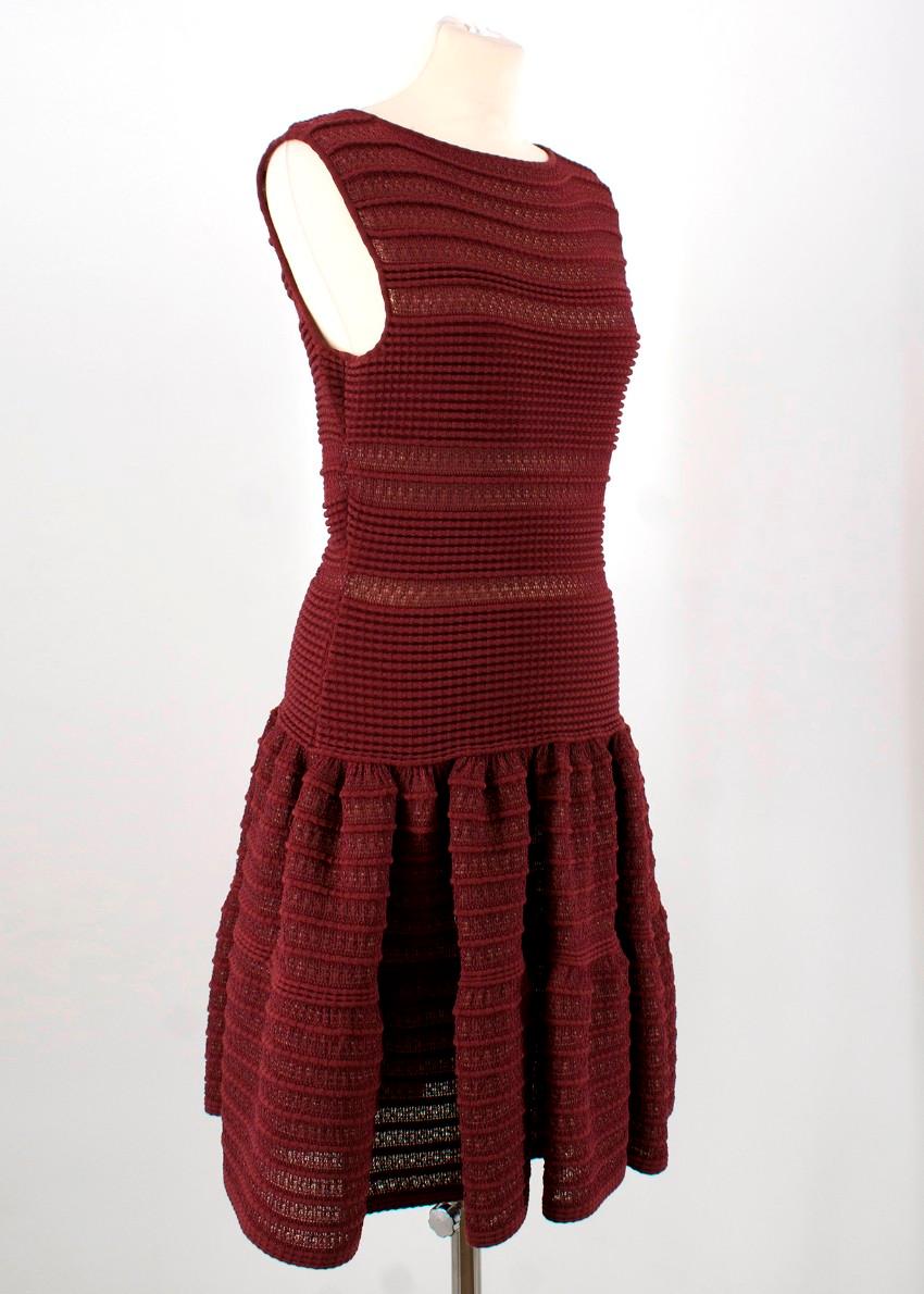 Alaia Wool Burgundy Dress

- Crochet style dress with horizontal pattern
- Tight top with a dropped waist and loose skirt 
- The dress itself is heavy and features a miniskirt

Measurements are taken with the item lying flat, seam to seam.
length -