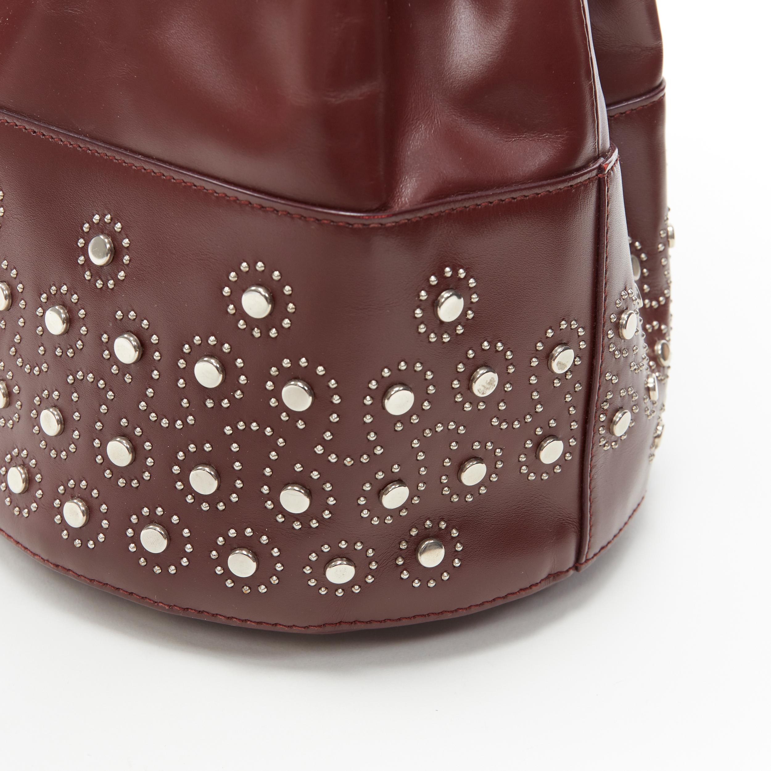ALAIA burgundy red geometric silver studded drawstring mirror charm bucket bag In Good Condition For Sale In Hong Kong, NT