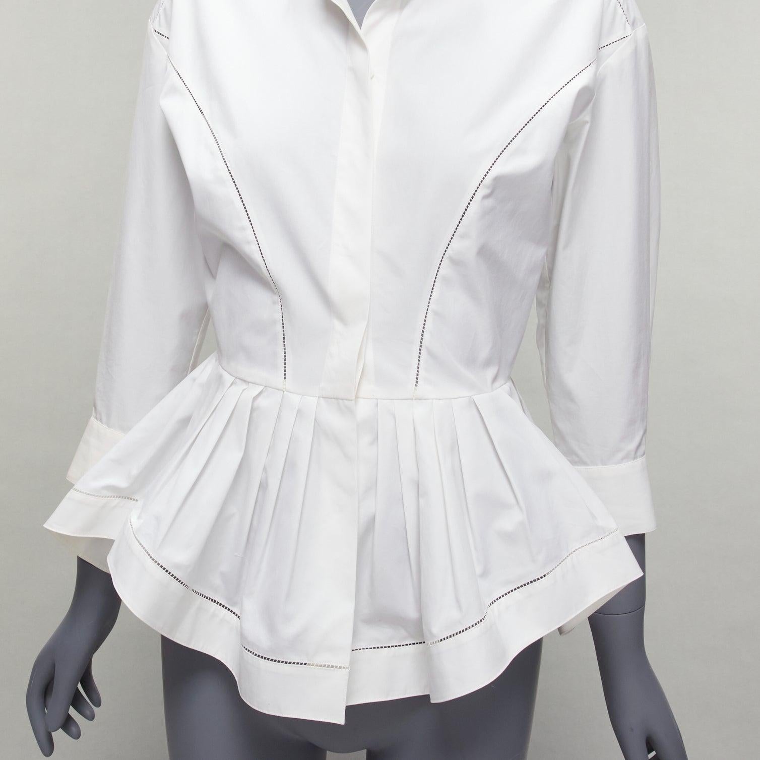 ALAIA cream cotton lattice seam ruffle peplum waist dress shirt FR36 S
Reference: SNKO/A00220
Brand: Alaia
Material: Cotton
Color: Cream
Pattern: Solid
Closure: Button
Extra Details: Concealed buttons. Peplum back.
Made in: