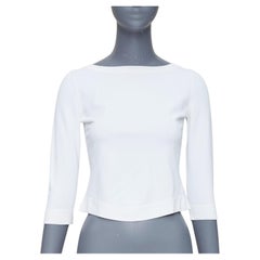 ALAIA suéter crema con mangas recortadas y cuello barco
