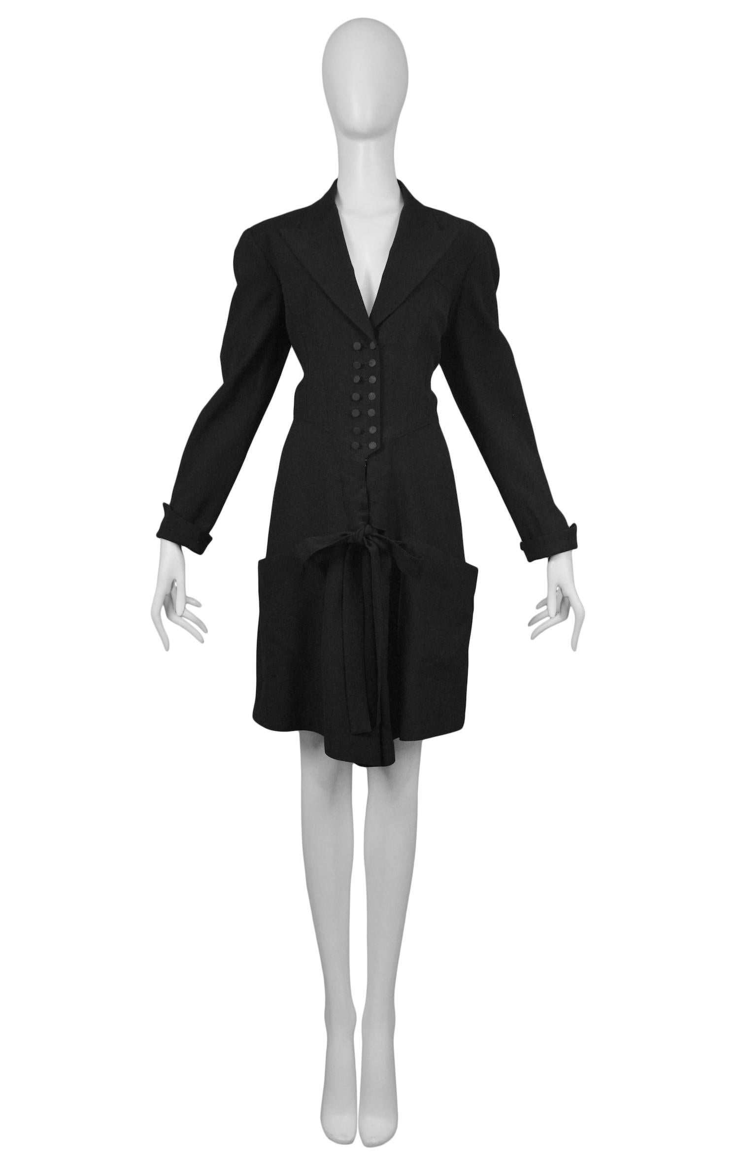 Vintage Azzedine Alaia black button front dinner suit shorts romper with covered buttons and bow tie front.

Excellent Condition.

Size 40-42

Measurements:
Shoulder 16