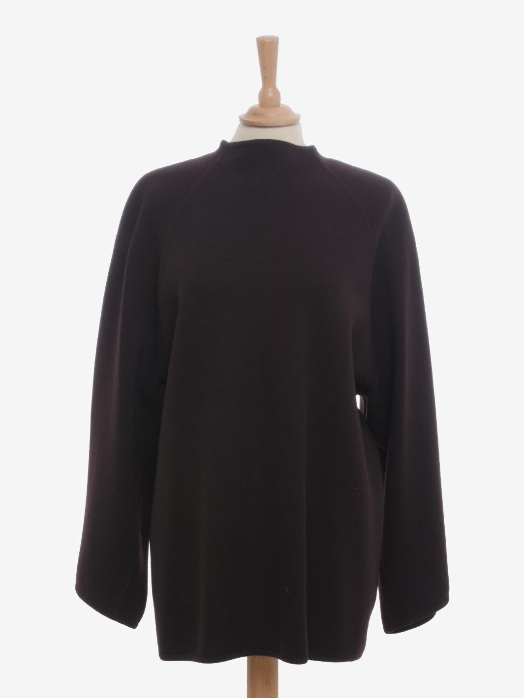 Alaïa Dolman Sleeve Wool Sweater is a rare garment designed by Azzedine Alaïa in the late 1980s. The garment in fine virgin wool has a comfortable fit, slightly dolman wide sleeves and padded shoulder straps. The collar is slightly high and