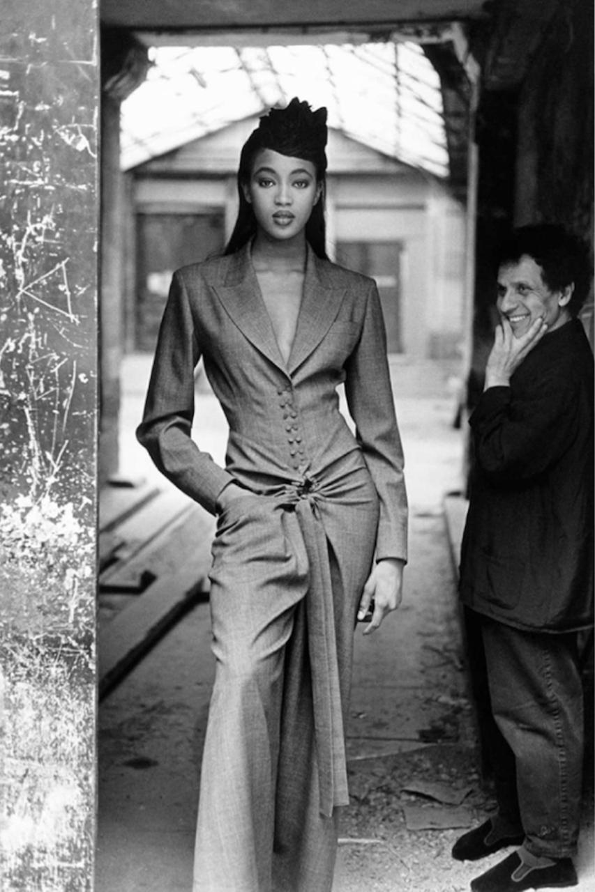 - Autumn /Winter 1998 Runway collection by Aezzedine Alaïa

- Sold by Mae Vintage London 

- Double breasted checked dress with cinched waist

- Held in the permeant collection of the Metropolitan Museum of Art, who describe why it is a perfect