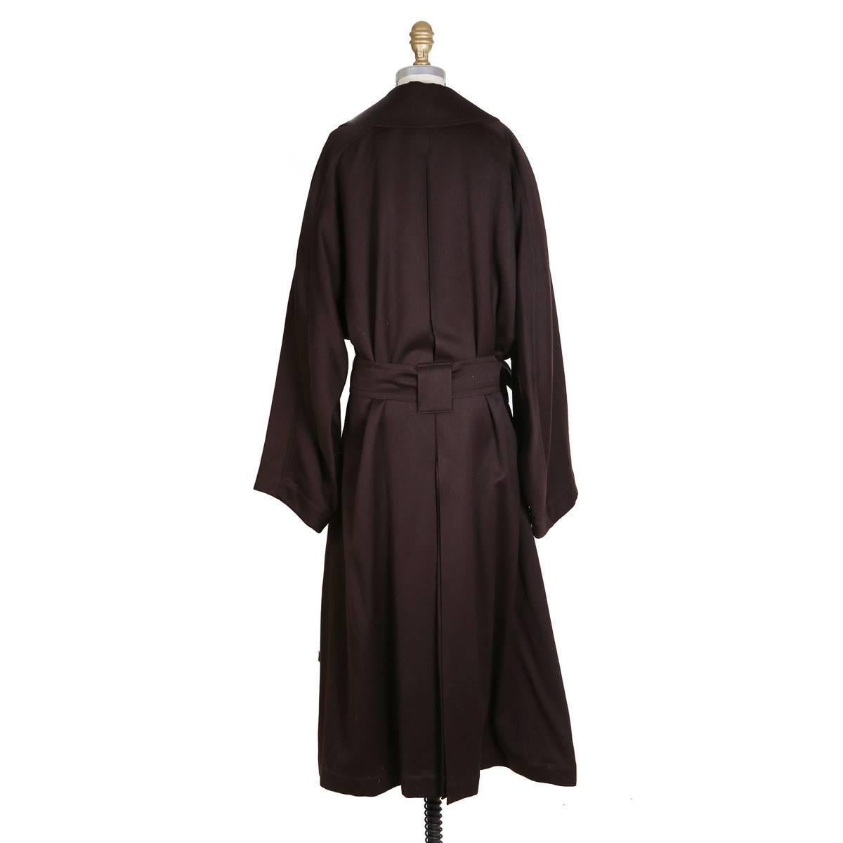 Long winter coat by Azzedine Alaia
Double breasted and includes belt
Dark plum color
Condition: Excellent vintage condition

Size/Measurements:
Size 6
46