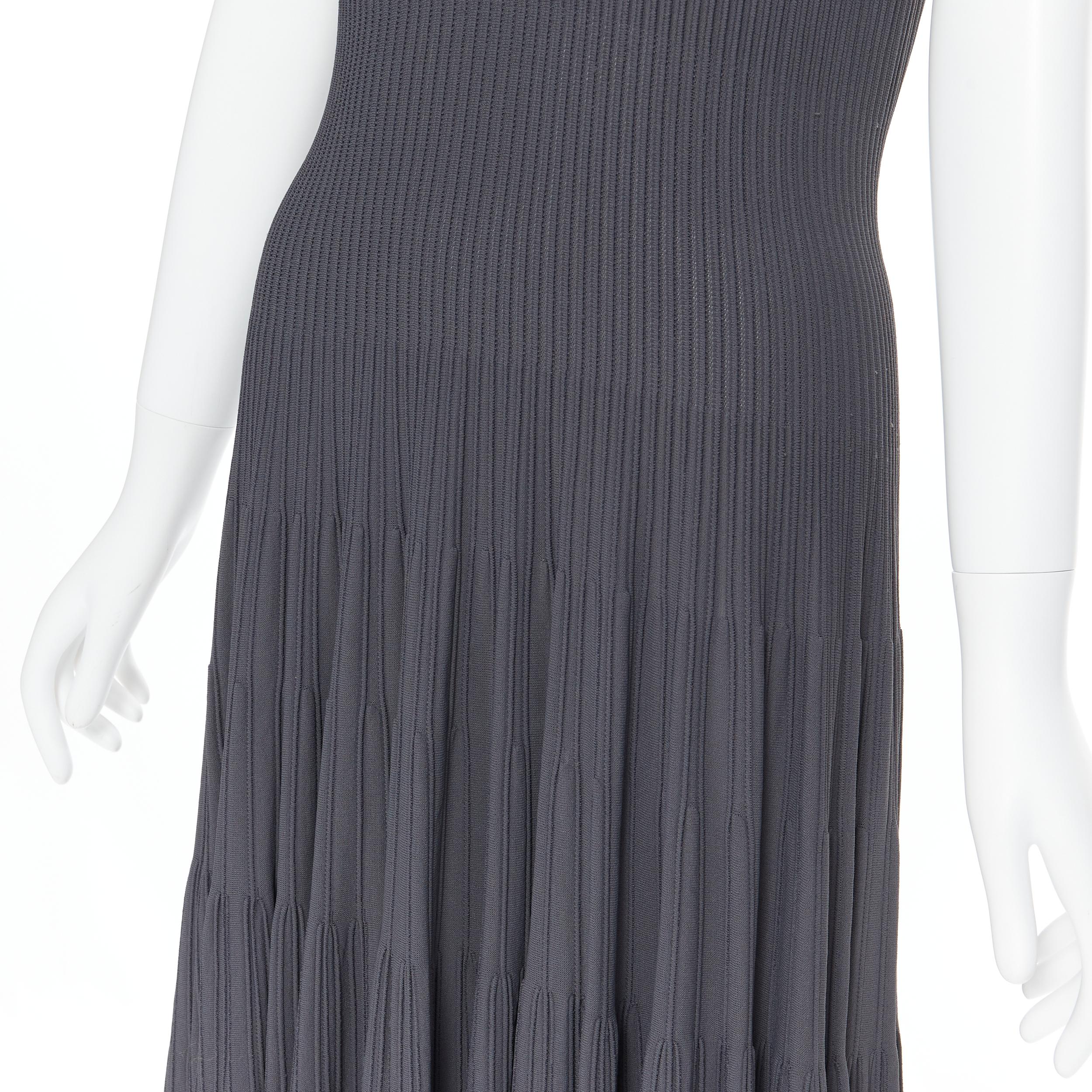 ALAIA dust grey ribbed V-neck sleeveless fit flared cocktail dress M 
Reference: AEMA/A00022 
Brand: Alaia 
Designer: Azzedine Alaia 
Material: Viscose 
Color: Grey 
Pattern: Solid 
Closure: Zip 
Extra Detail: V-neck. Ribbed fabrication. Dropped