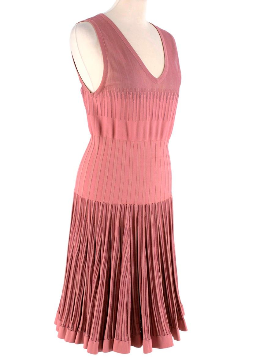 Alaia Dusty Rose Stretch Knit Ribbed Skater Dres
 

 - Signature Alaia ribbed knit dress, featuring different contrasting tones and weights of knit for a shaded effect
 - Semi-sheer bodice panels
 - V-neckline
 - Skater style skirt, with a pleated