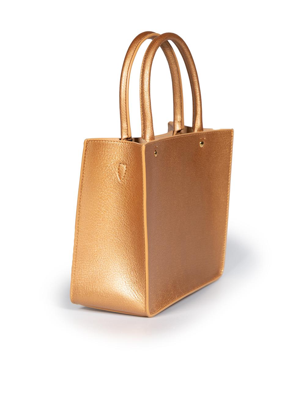 CONDITION is Never worn, with tags. No visible wear to bag is evident on this new Alaïa designer resale item.



Details


Gold

Leather

Hand bag

2x Rolled top handles

Gold tone hardware

1x Main compartment

1x Detachable