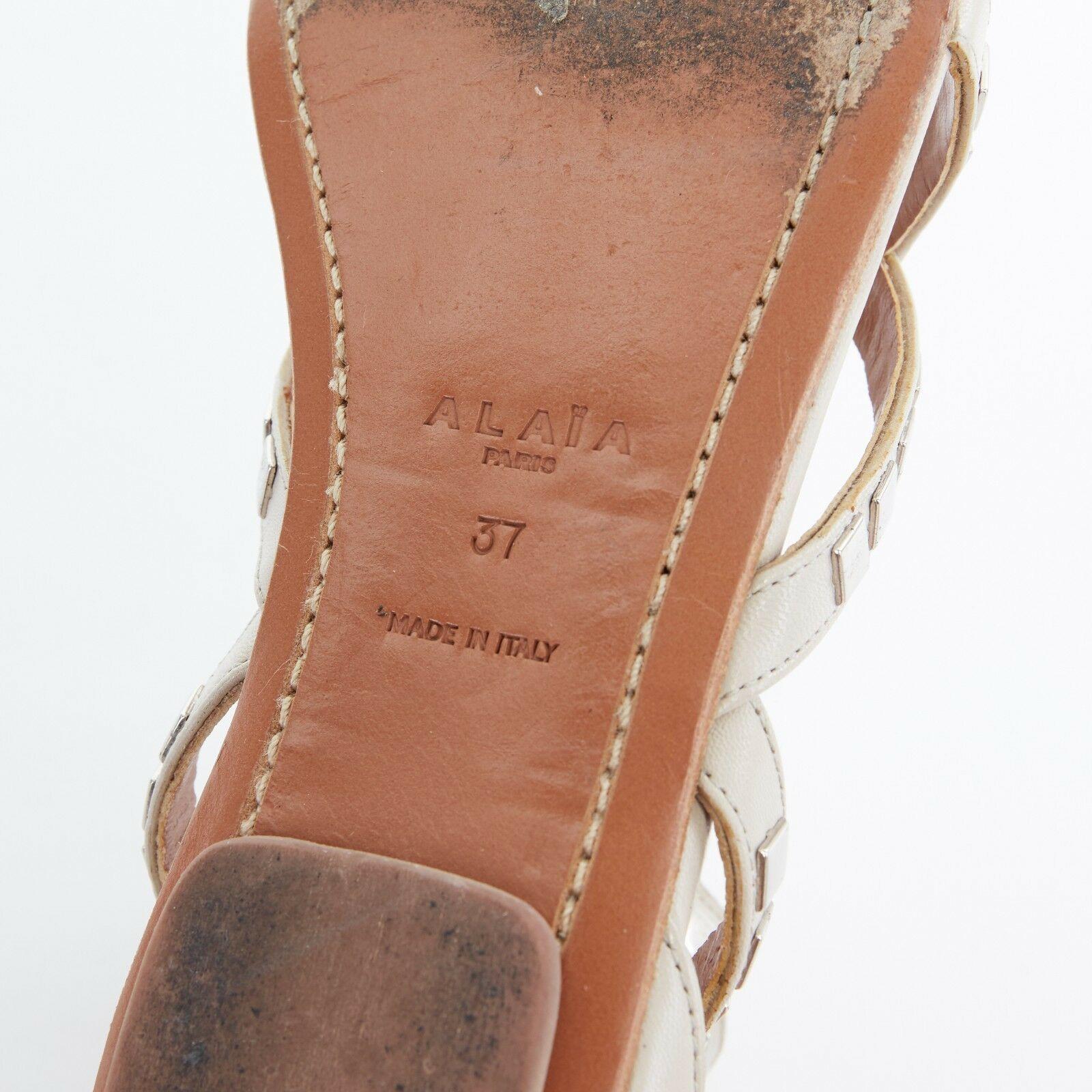 ALAIA grey leather silver square metal applique jagged strap flat sandals EU37 6