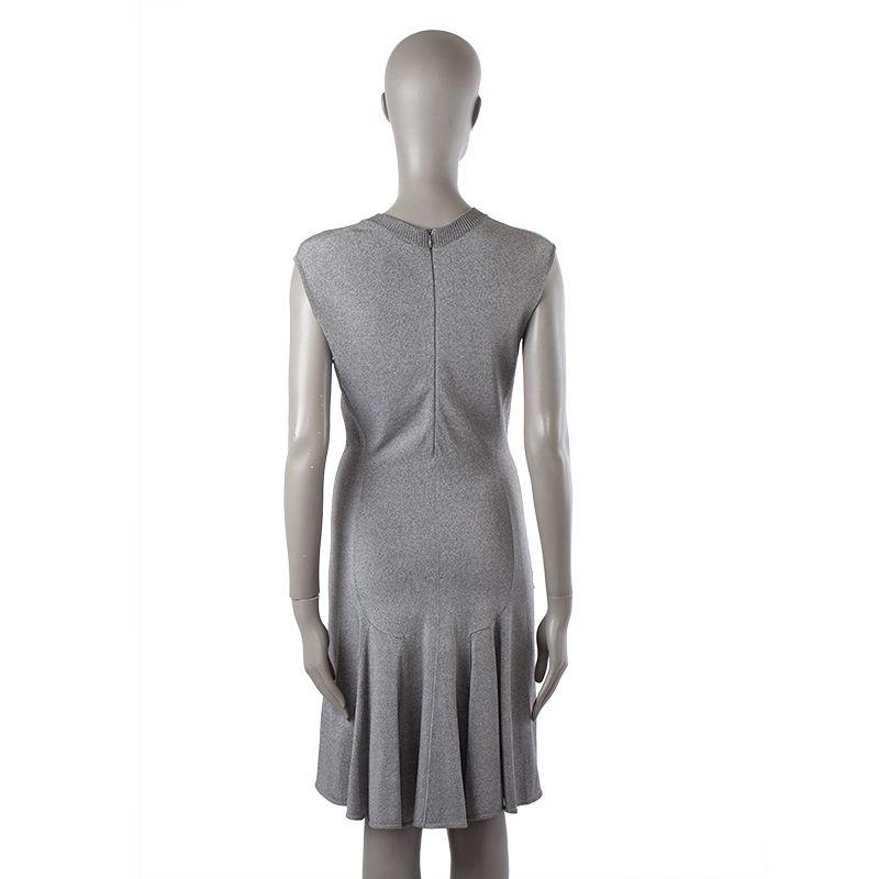 Alaia vintage sleeveless V-neck dress in grey viscose, nylon, and elastane blend (assumed as tag is missing). Closes with invisible back zipper. Unlined. Seam on the right side is slightly worn out, otherwise in very good condition.

Tag Size