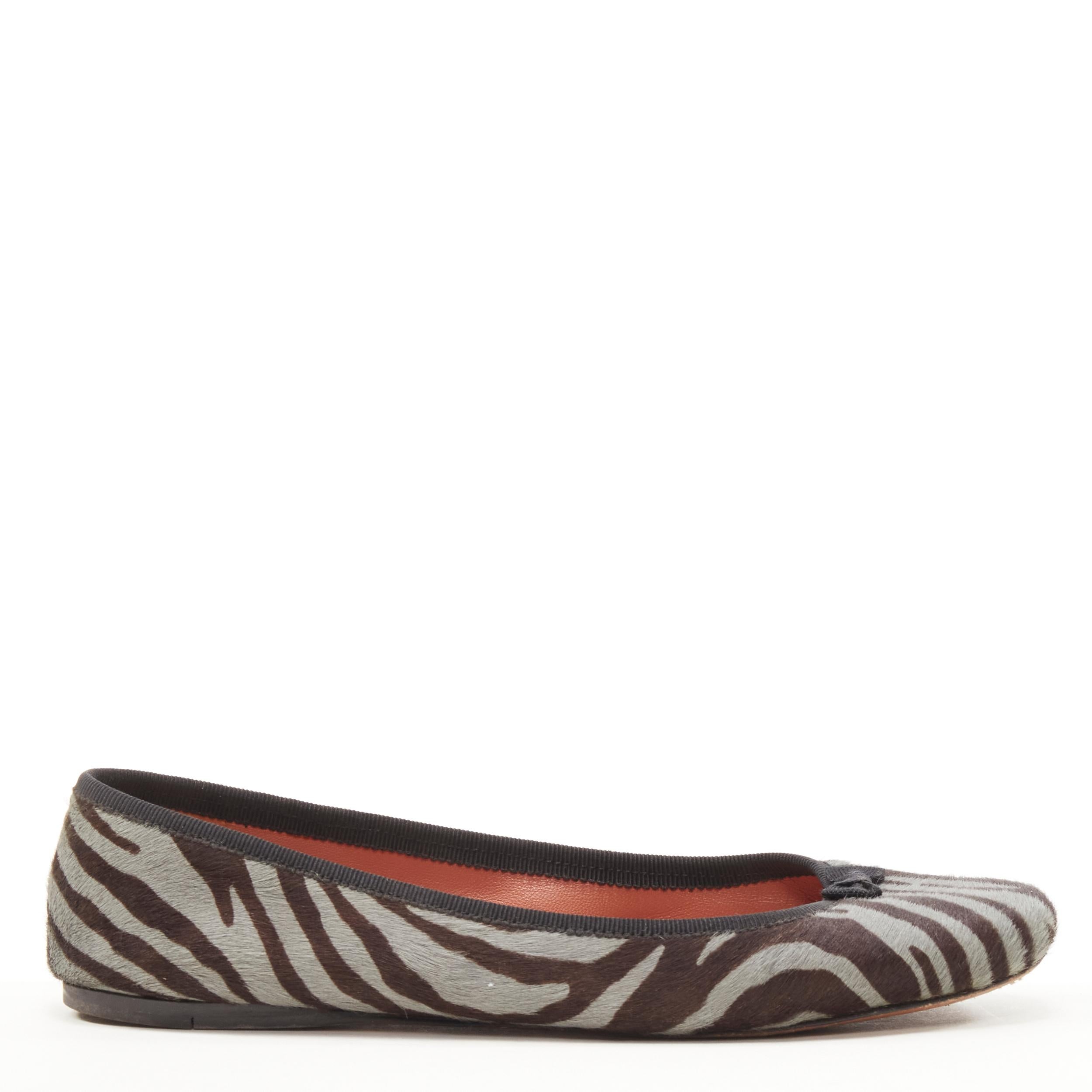 ALAIA grey zebra stripe calf hair bow trim ballerina flats EU37.5 
Reference: SNKO/A00186 
Brand: Alaia 
Material: Calf hair 
Color: Grey 
Pattern: Zebra 
Made in: Italy 

CONDITION: 
Condition: Good, this item was pre-owned and is in good
