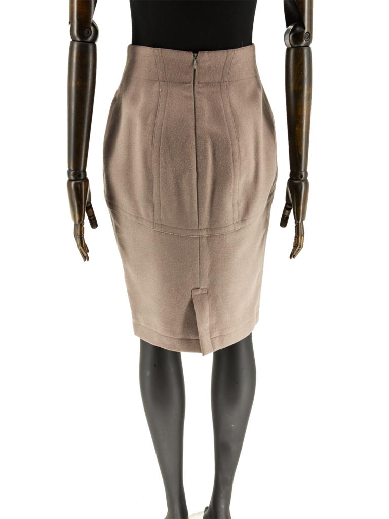 A circa 1985 Alaïa khaki wool worsted twill woven fitted tapered skirt with grown-on waistband, deep drop shaped basque, style lines and back vent, finished with a top-stitched highlight detail throughout, fully lined in a rose quartz satin lining.