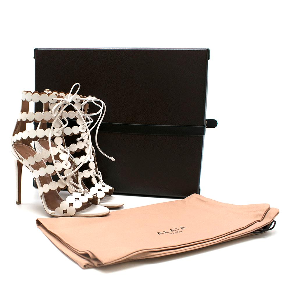 Alaia Laser-cut Leather And Suede White Sandals

-White leather and suede
-Multiple caged straps
-Ties at ankle
-Lazer-cut design 
-White Lace up
-Leather nude insole and sole
-Box and dust bag included

 Please note, these items are pre-owned and