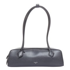 ALAIA Le Teckel black leather elongated long handle double zip bag