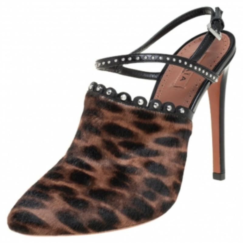 These chic sandals by Alaia are the most versatile pair you can possibly own. Keep it casual and chic with these sandals crafted from leopard-printed calf hair and leather. The scalloped trims embellished with studs on the vamps and ankle straps add