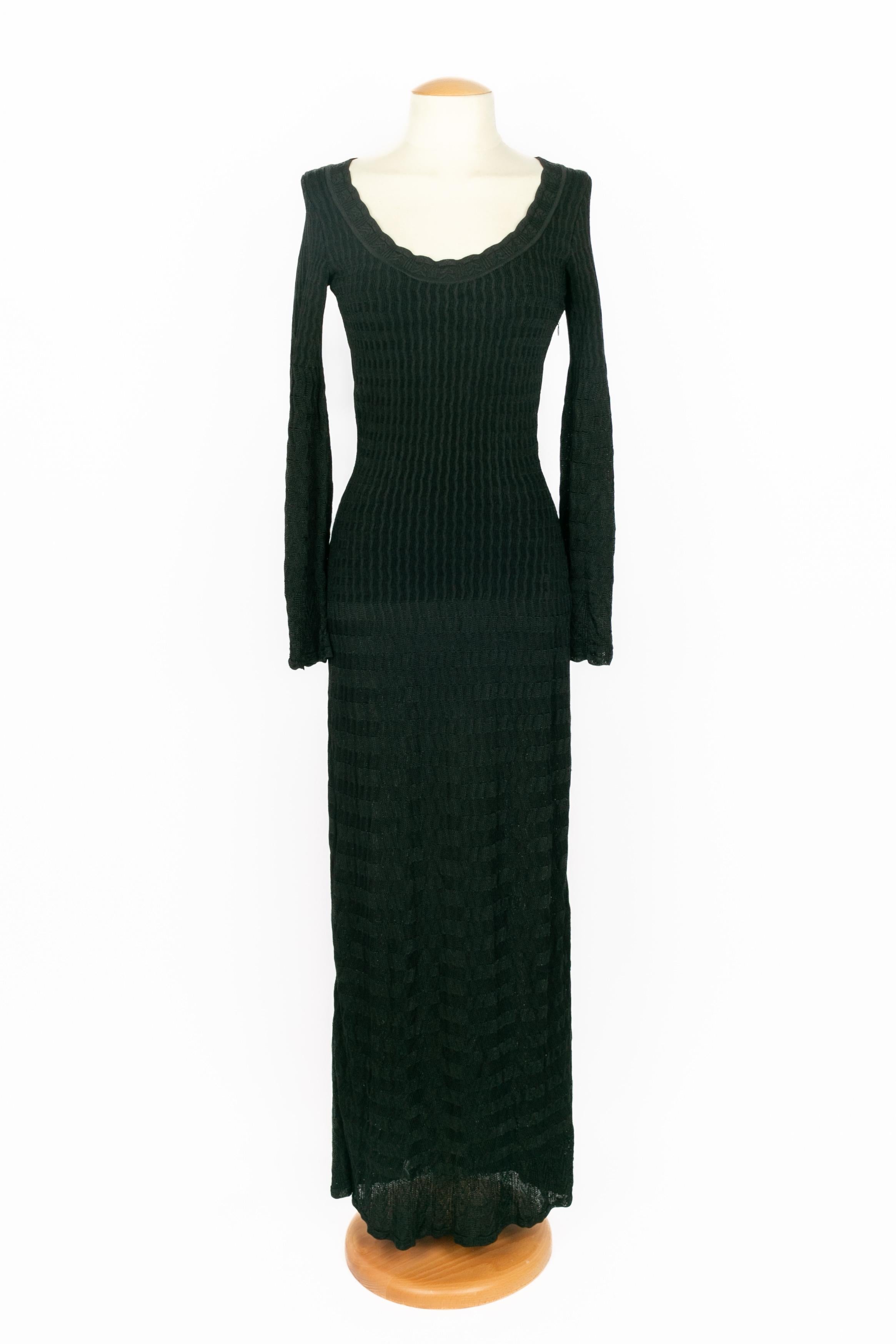 ALAÏA - (Made in Italy) Long black mesh stretch dress with flared long sleeves. Size 40IT indicated, it fits a 36FR.

Condition:
Very good condition

Dimensions:
Shoulder width: 40 cm - Chest: 39 cm - Waist: 30 cm - Hips: 41 cm - Sleeve length: 63