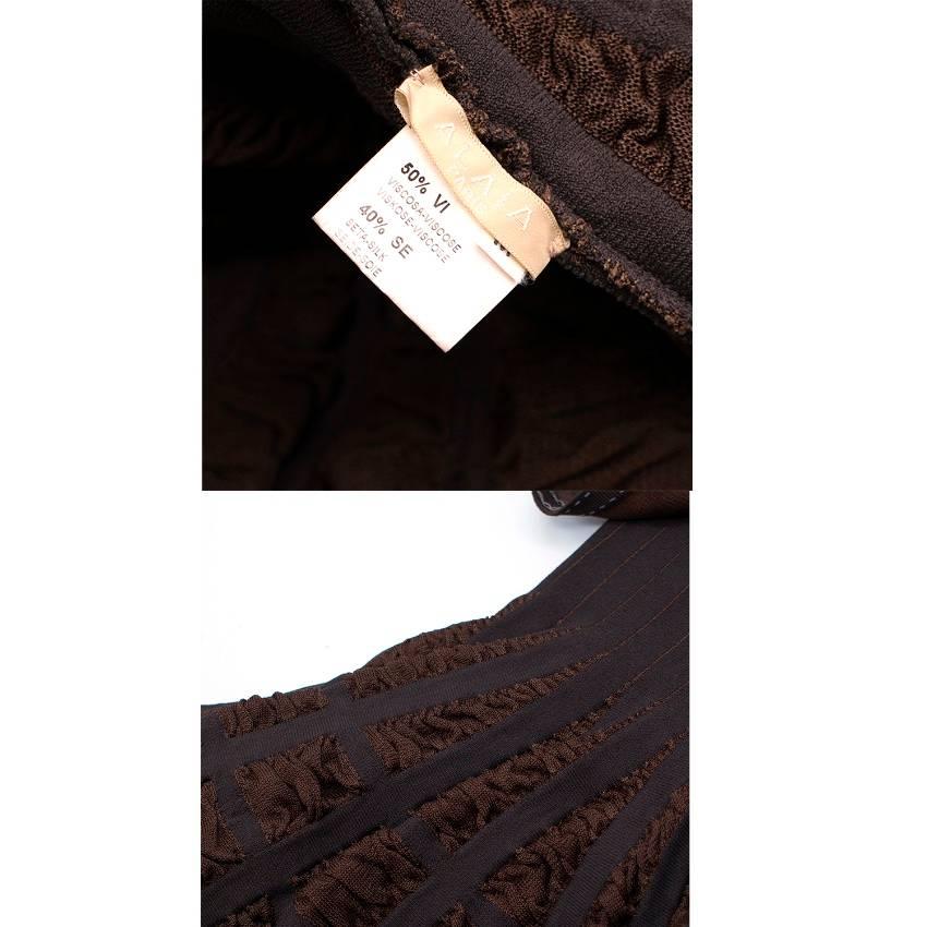 Alaia Mid-length Chocolate Brown Skater Dress.

Featuring brown stretch knit with a deep round cleavage, sleeveless design, frilled skirt in a pleated knit and closure in the back with an invisible zipper.

Fabric: 50% viscose, 50% silk.

Condition: