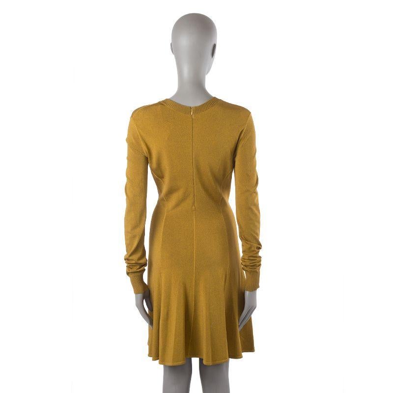 Alaia vintage long-sleeve V-neck dress in mustard viscose, nylon, and elastane blend (assumed as tag is missing). Closes with invisible back zipper. Unlined. Has been worn and is in excellent condition.

Tag Size S
Size S
Shoulder Width 40cm