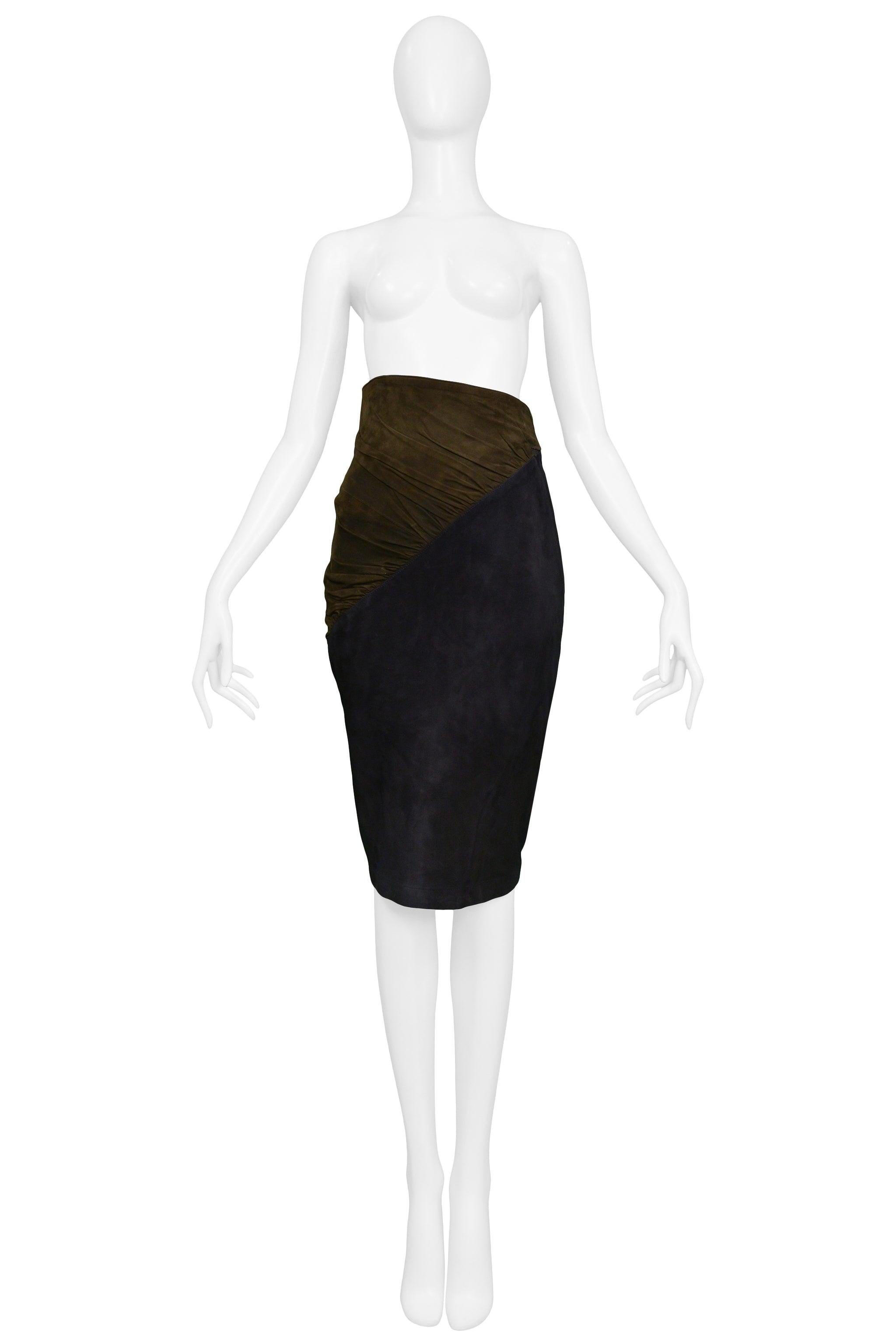 Resurrection Vintage is excited to offer a vintage Azzedine Alaia navy and brown suede skirt featuring a high-waist, a brown gathered asymmetrical panel that also functions as a belt with a ring buckle, slim pencil skirt body, hidden side zipper,