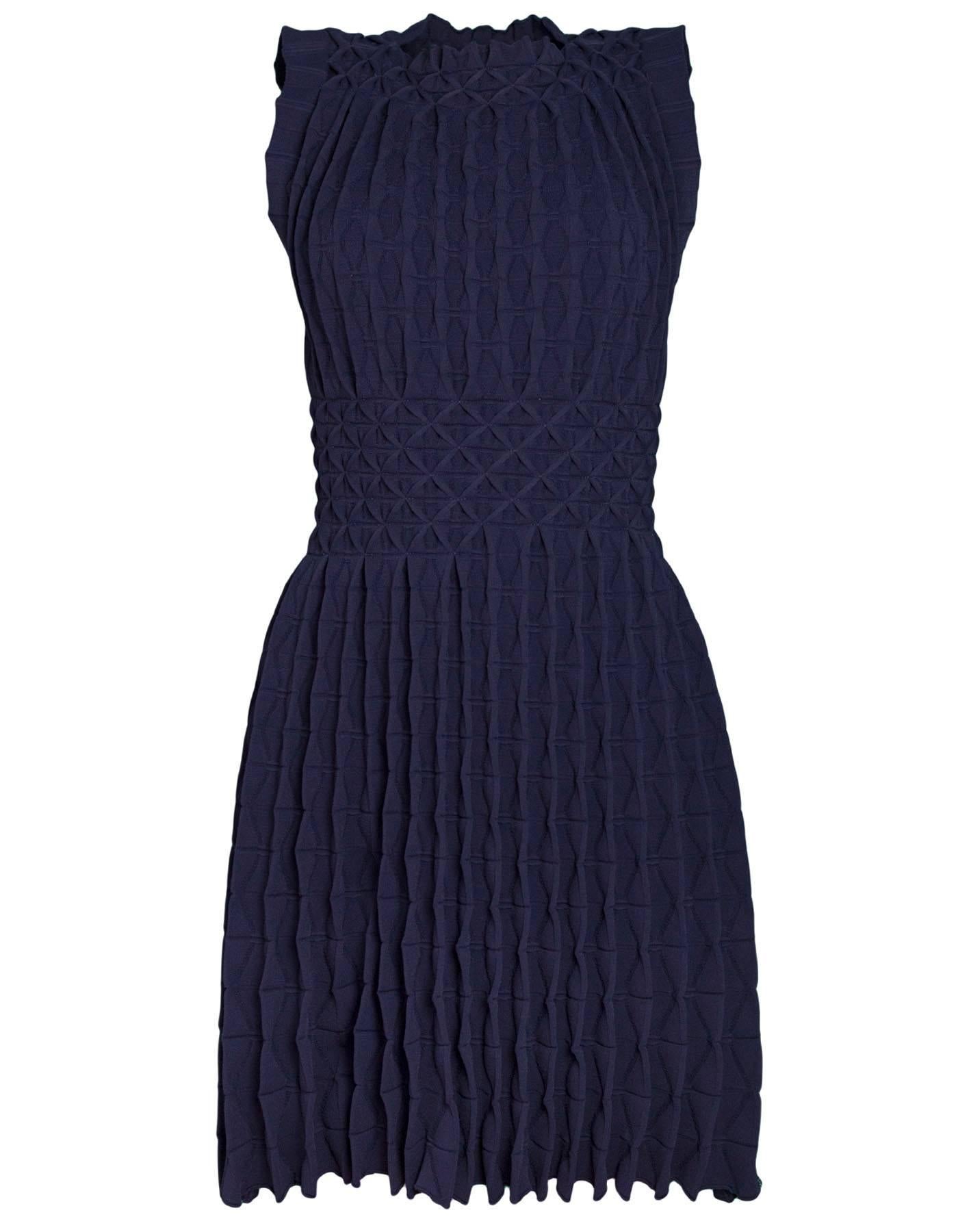 Alaia Navy Sleeveless Gathered Fit Flare 

Made In: Italy
Color: Navy
Composition: 80% viscose, 20% polyester
Lining: None
Closure/Opening: Pull over
Exterior Pockets: None
Interior Pockets: None
Overall Condition: Excellent pre-owned
