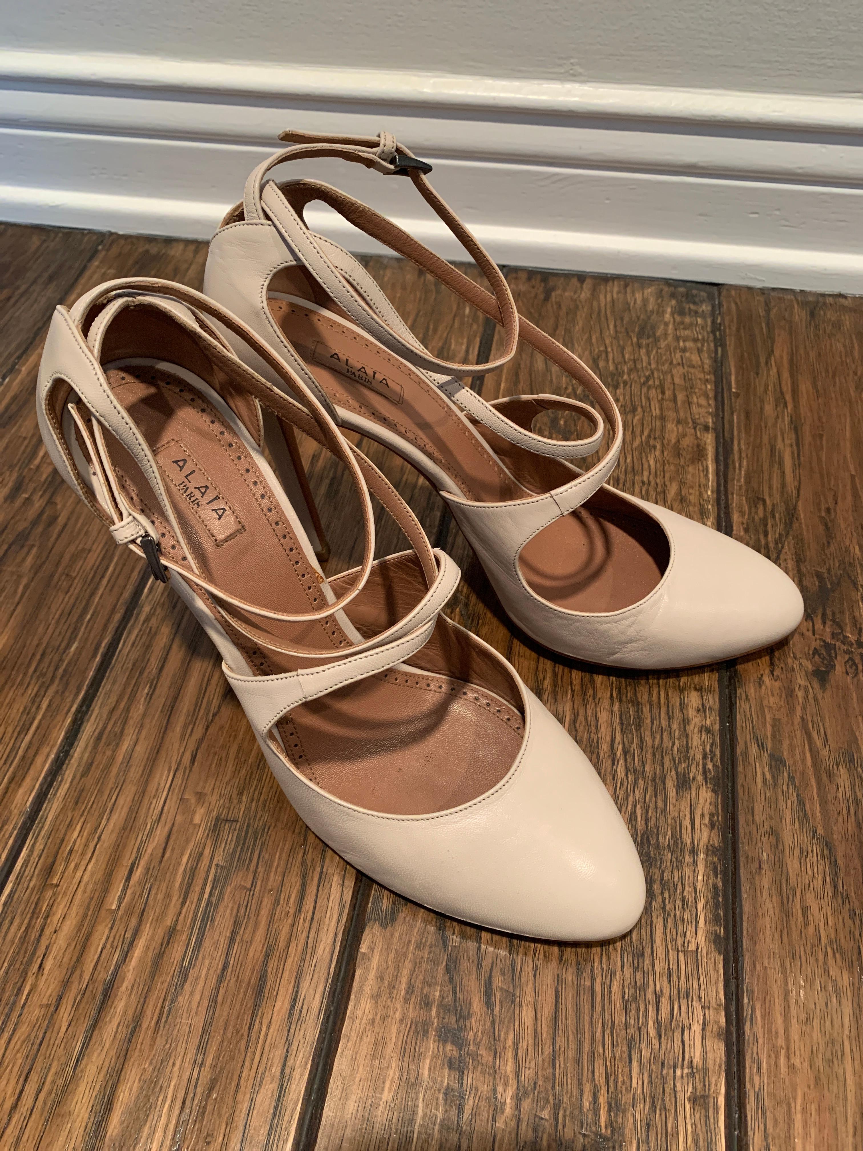 Alaia Classic Nude Mary-Jane Pumps. 
Cross Strap around Ankle 
Mint Condition 
No signs of wear 
Size 40.5 