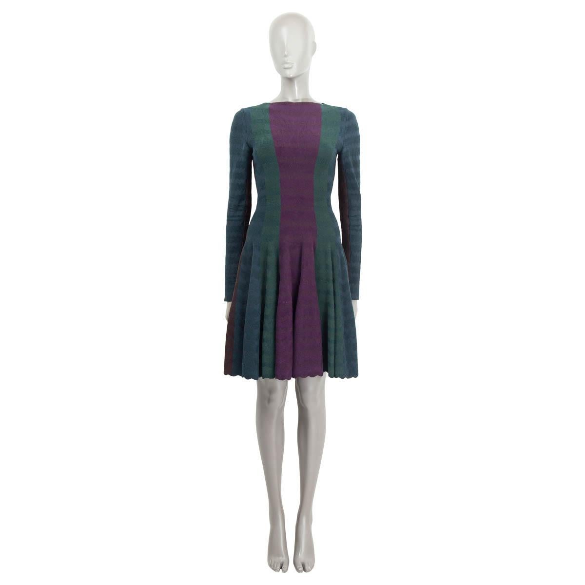 100% authentic Alaïa long-sleeve flared color block dress in espresso brown, eggplant, forest green, petrol and black viscose (55%), wool (20%), polyamide (20%) and elastane (5%). Opens with a zipper on the back. Unlined. Has been worn and is in