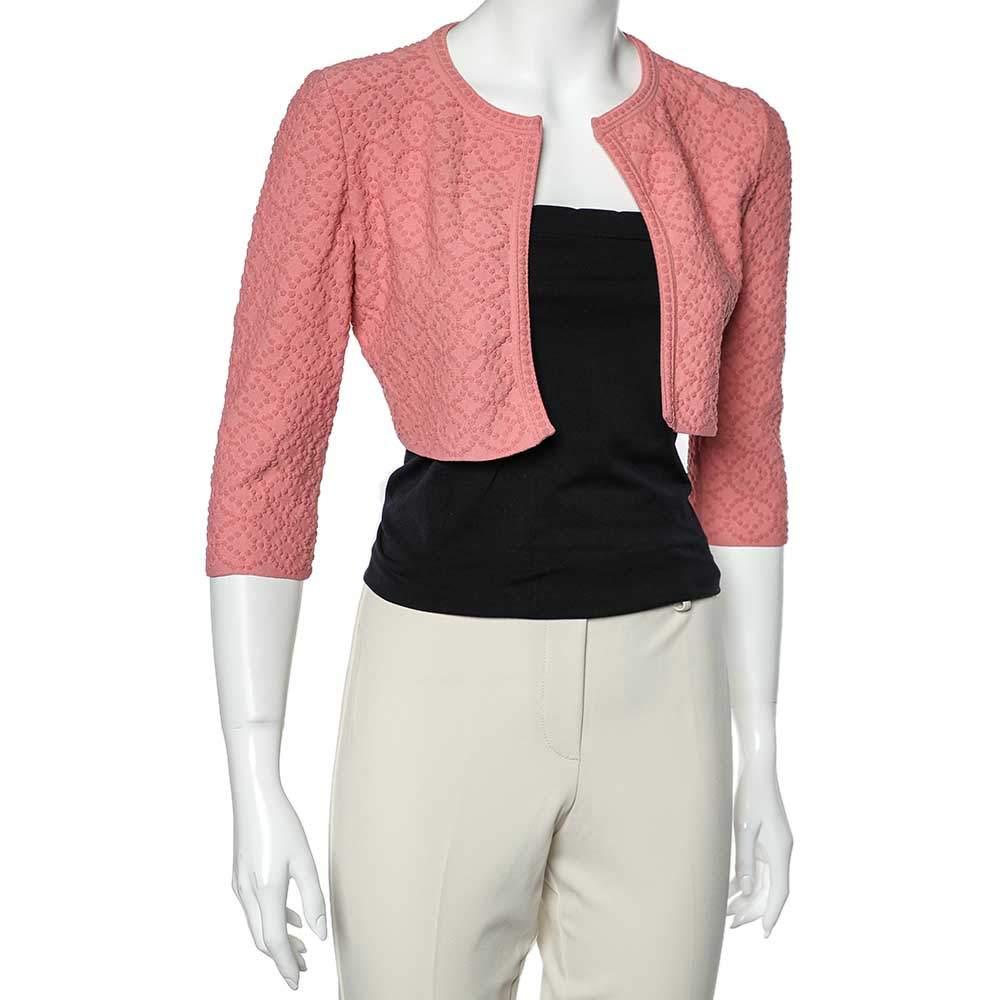 Look uber-chic and elegant wearing this Alaia cropped shrug. The versatile piece has been crafted from patterned knit fabric into a feminine, flattering shape. Accessorize with a shoulder bag and sunglasses.

