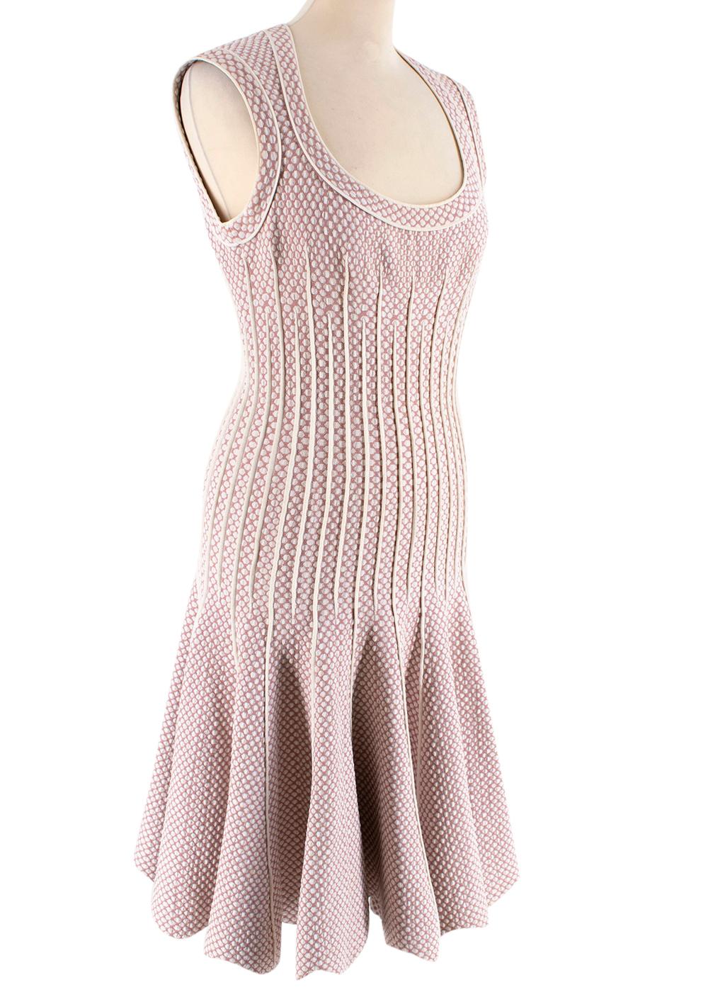 Alaia Pink & White Embroidered Knit Skater Dress

- Dusty rose and white patterned polka dot dress
- Stretchy fabric fitted around the waist
- Wide round low neckline
- Sleeveless 
- White hem patterned on the waist for accentuated illusion 
-