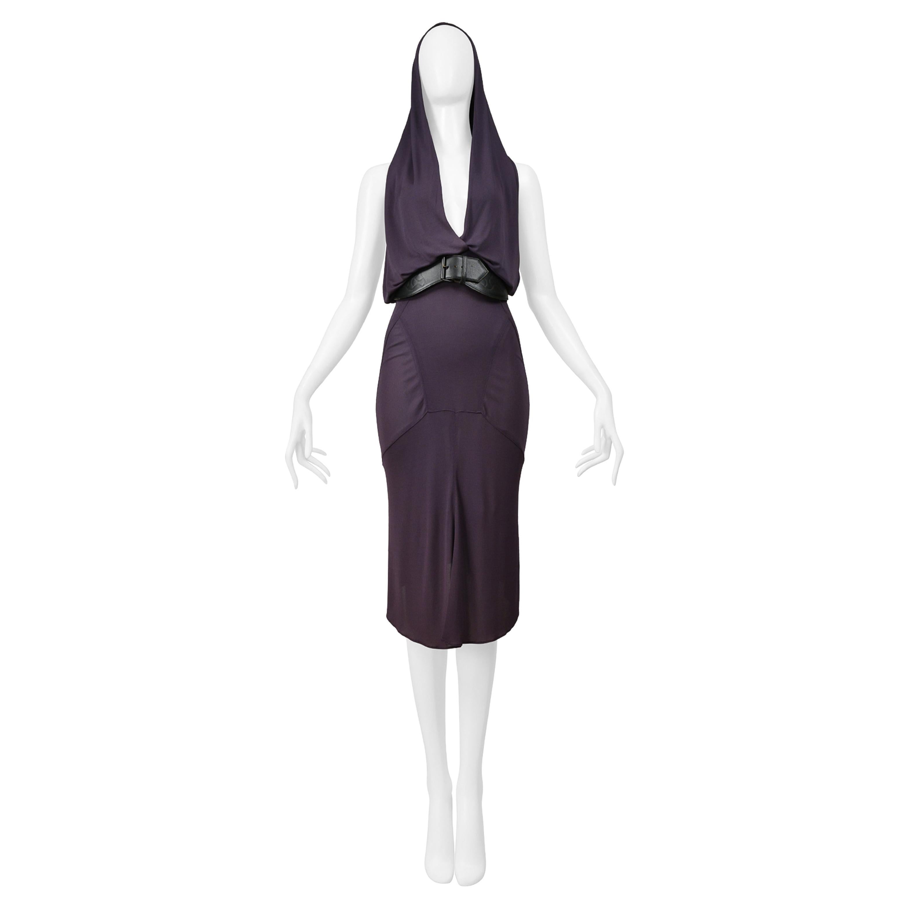Resurrection Vintage is excited to offer a vintage Azzedine Alaia purple jersey dress featuring a halter front, exposed back, and fitted skirt with lingerie stitching detail, flounce at skirt, snaps at center back. The belt is sold separately. 
*