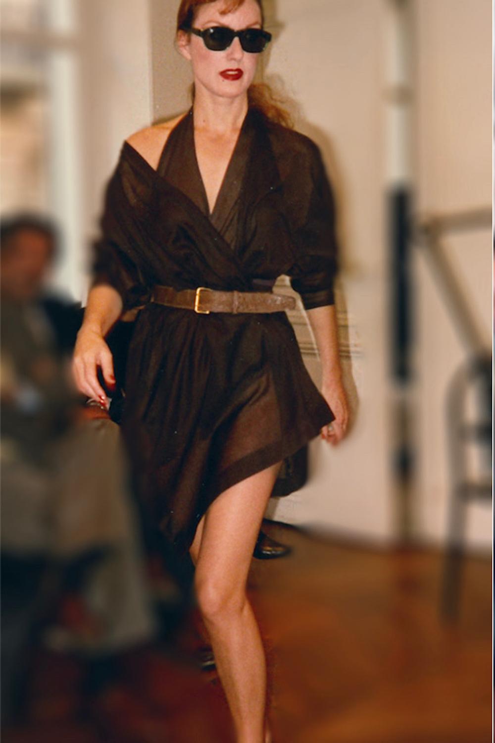 - Spring / Summer 1984 Alaïa Runway collection by Azzedine Alaïa

- Sold by Mae Vintage 

- Dark teal, wrap around tunic with button fastening at waist , asymmetric hem and open lower back