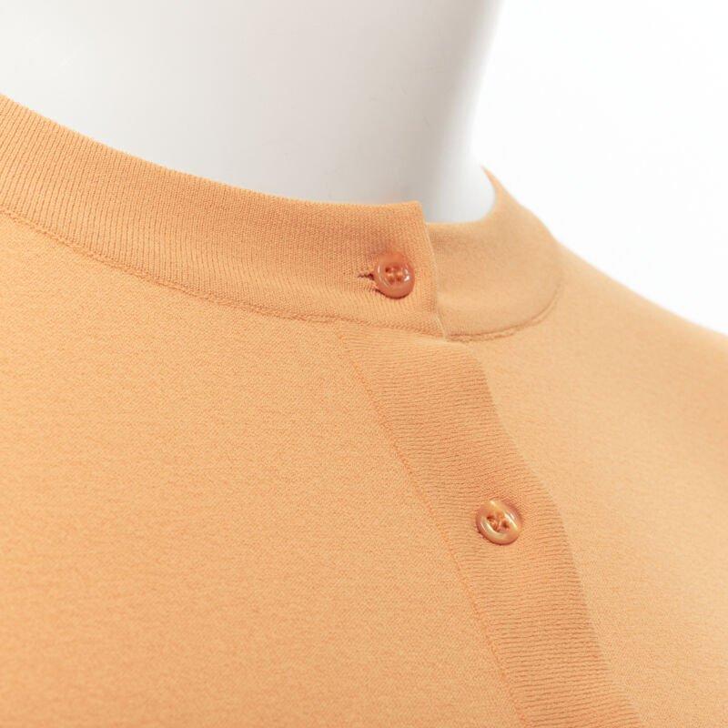 ALAIA Signature cropped stretch knit button cardigan Peche orange FR38 S
Reference: TGAS/B01927
Brand: Alaia
Designer: Azzedine Alaia
Collection: Permanent
Material: Viscose, Polyester
Color: Orange
Pattern: Solid
Closure: Button
Extra Details: An
