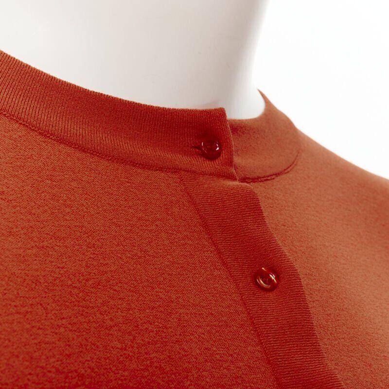 ALAIA Signature cropped stretch knit cardigan Sanguine Orange FR36 XS
Reference: TGAS/B01944
Brand: Alaia
Designer: Azzedine Alaia
Collection: Permanent
Material: Viscose, Polyester
Color: Orange
Pattern: Solid
Closure: Button
Extra Details: An