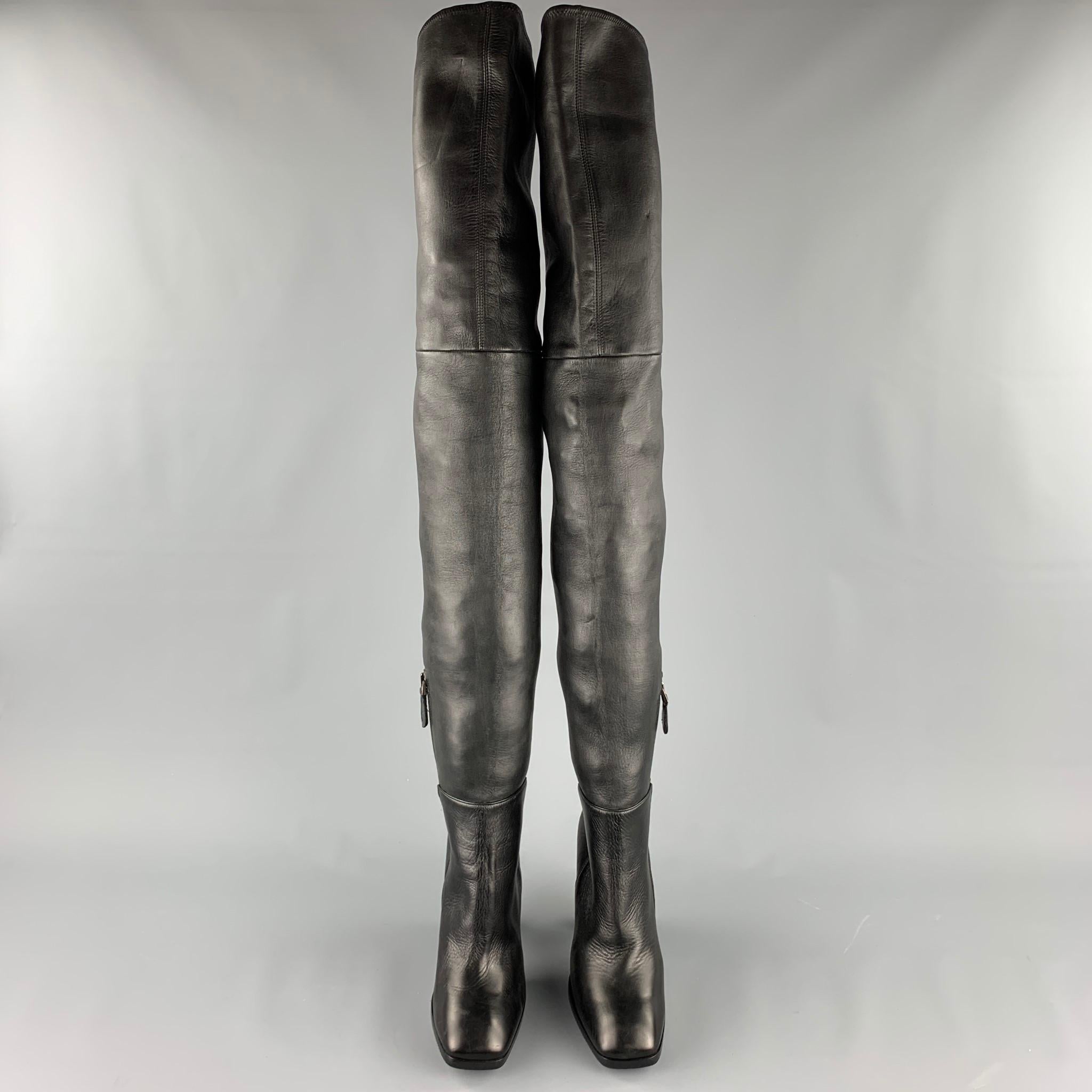 ALAIA boots comes in a black leather featuring a over the knee style, chunky heel, wooden sole, and a side zipper closure. Made in Italy. 

New Without Tags. 
Marked: EU 40
Original Retail Price: $1,750.00

Measurements:

Length: 8.5 in.
Width: 3