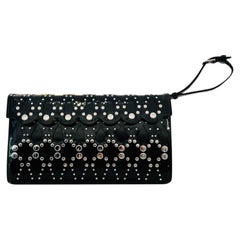 Pochette in pelle con borchie Alaia