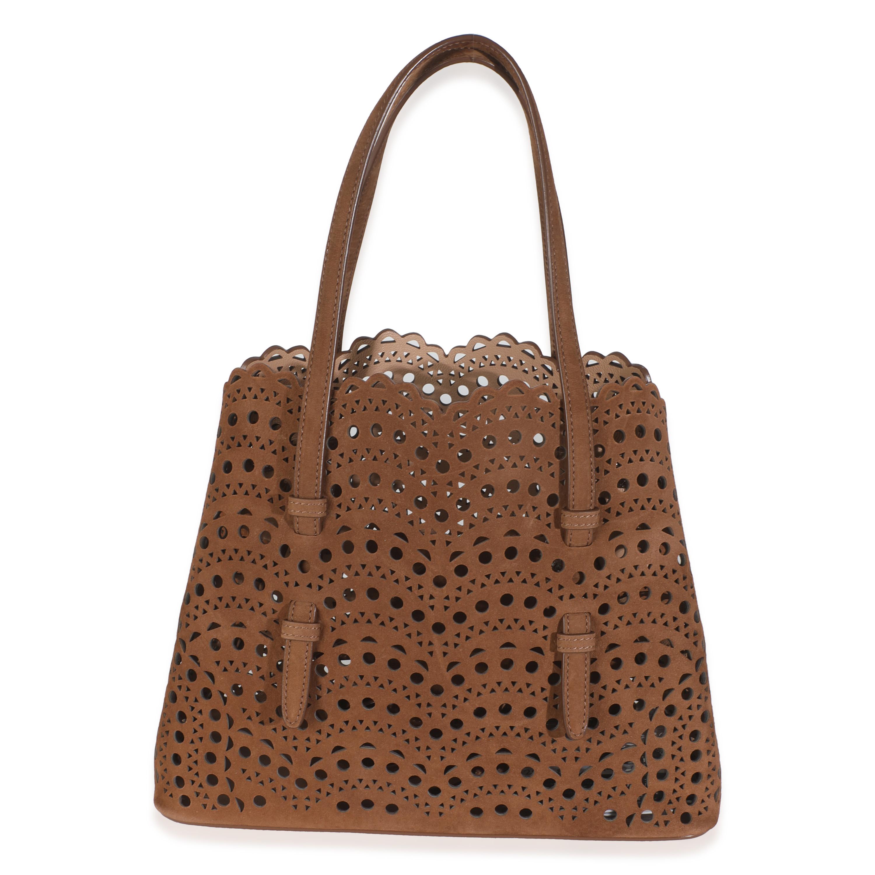 Listing Title: Alaia Tan Laser Cut Suede Mina 25
SKU: 145790
MSRP: 2550.00 USD
Condition: Pre-owned 
Handbag Condition: Pristine
Condition Comments: Item has no indication of wear.  Final sale.
Brand: Alaia
Model: Mina 25
Origin Country: