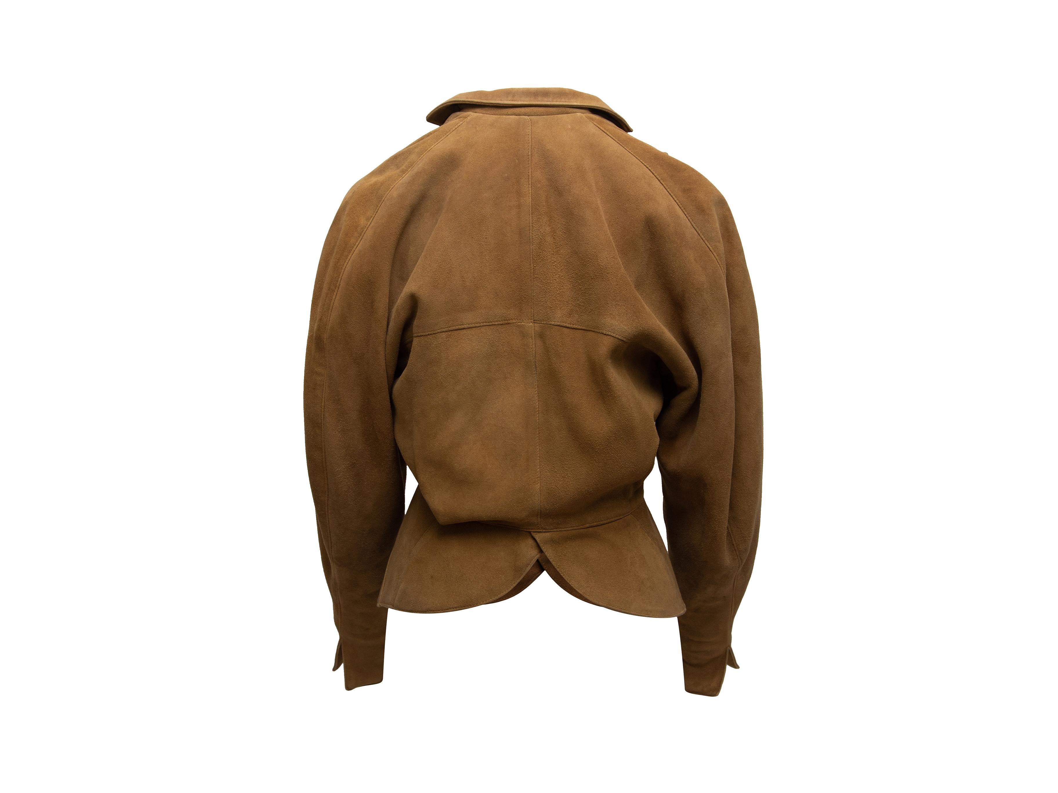 Product details: Vintage tan suede double-breasted jacket by Alaia. Oversize collar. Peplum hem. Button closures at front. Designer size 38. 40