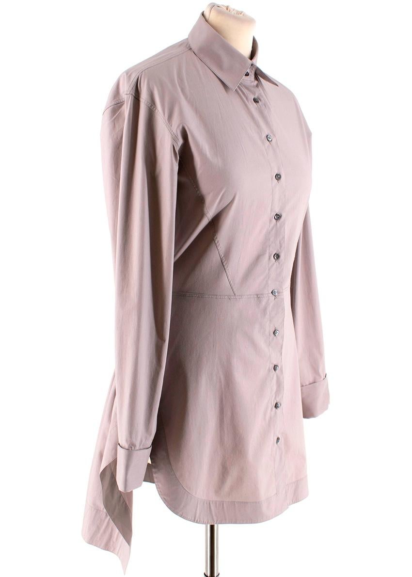 Alaia Taupe Stretch Waist Longline Shirt

Collared
Cinched with elastic at back of the waist
Small metallic buttons down the dress and on the cuffs
Stitched detail provides structure across the chest, waist and back of the skirt
Dry Clean