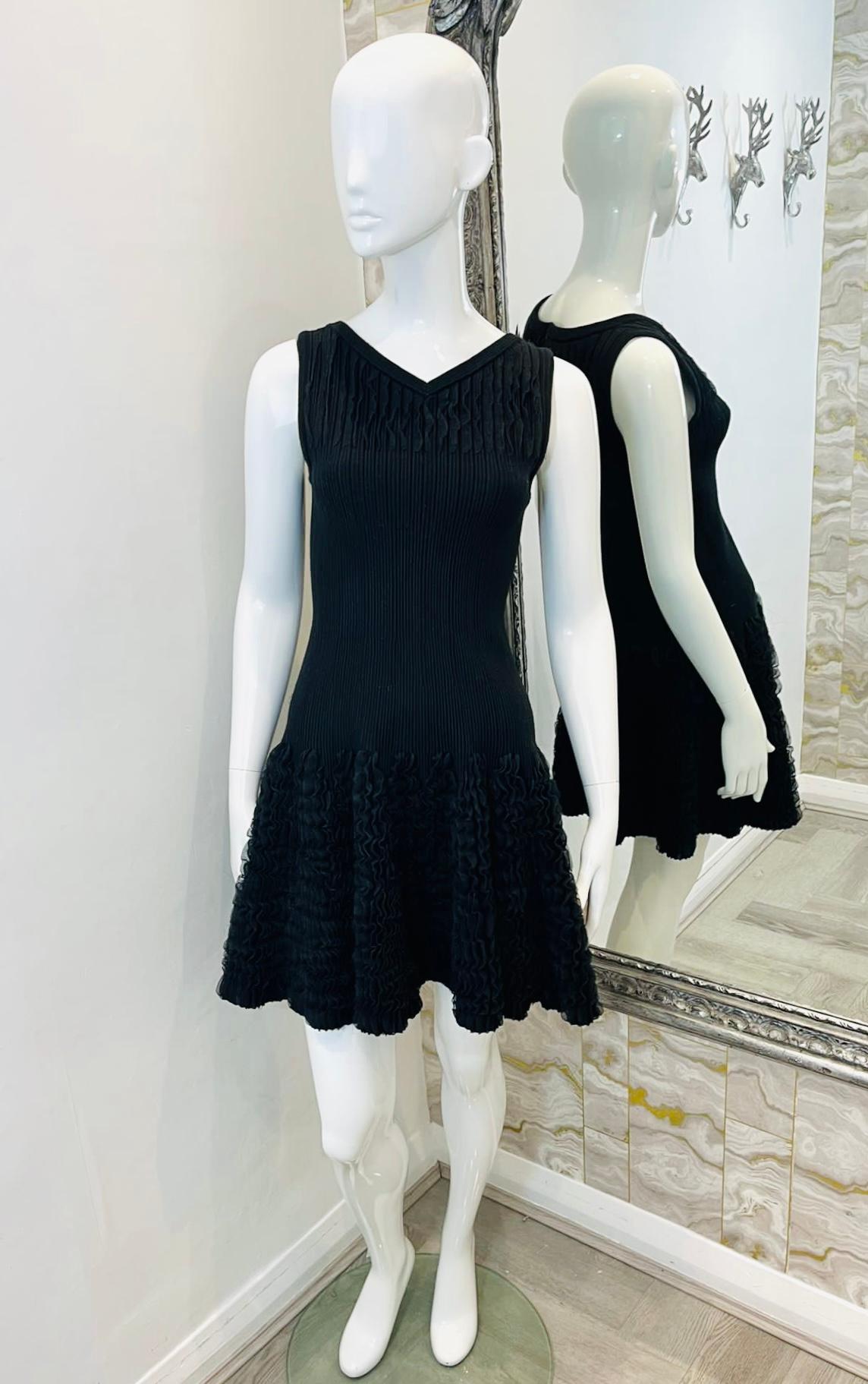 Alaia Textured Wool Dress

Black mini, sleeveless dress crafted in a flared silhouette.

Featuring textured design to the V-Neckline and skirt.

Detailed with sleeveless style and concealed zip fastening to rear.

Size – 40IT

Condition – Very
