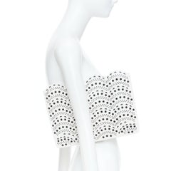 ALAIA Vienne laser cut white leather black lined scalloped zip pouch clutch bag