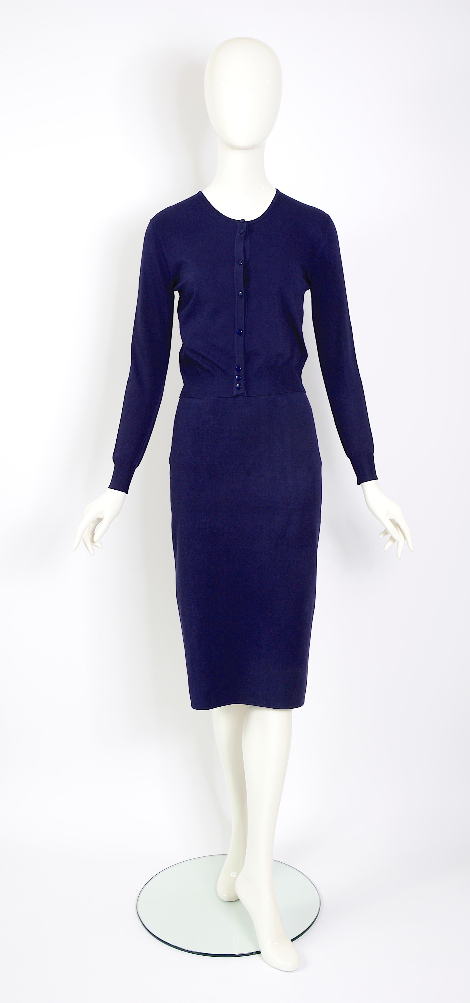 Absolutely stunning and in perfect condition, vintage cardigan & skirt set by Azzedine Alaia. Iconic body con skirt with matching cardigan made in a midnight blue stretch viscose mix knit.

Labeled size Small, but can accommodate a variety of sizes