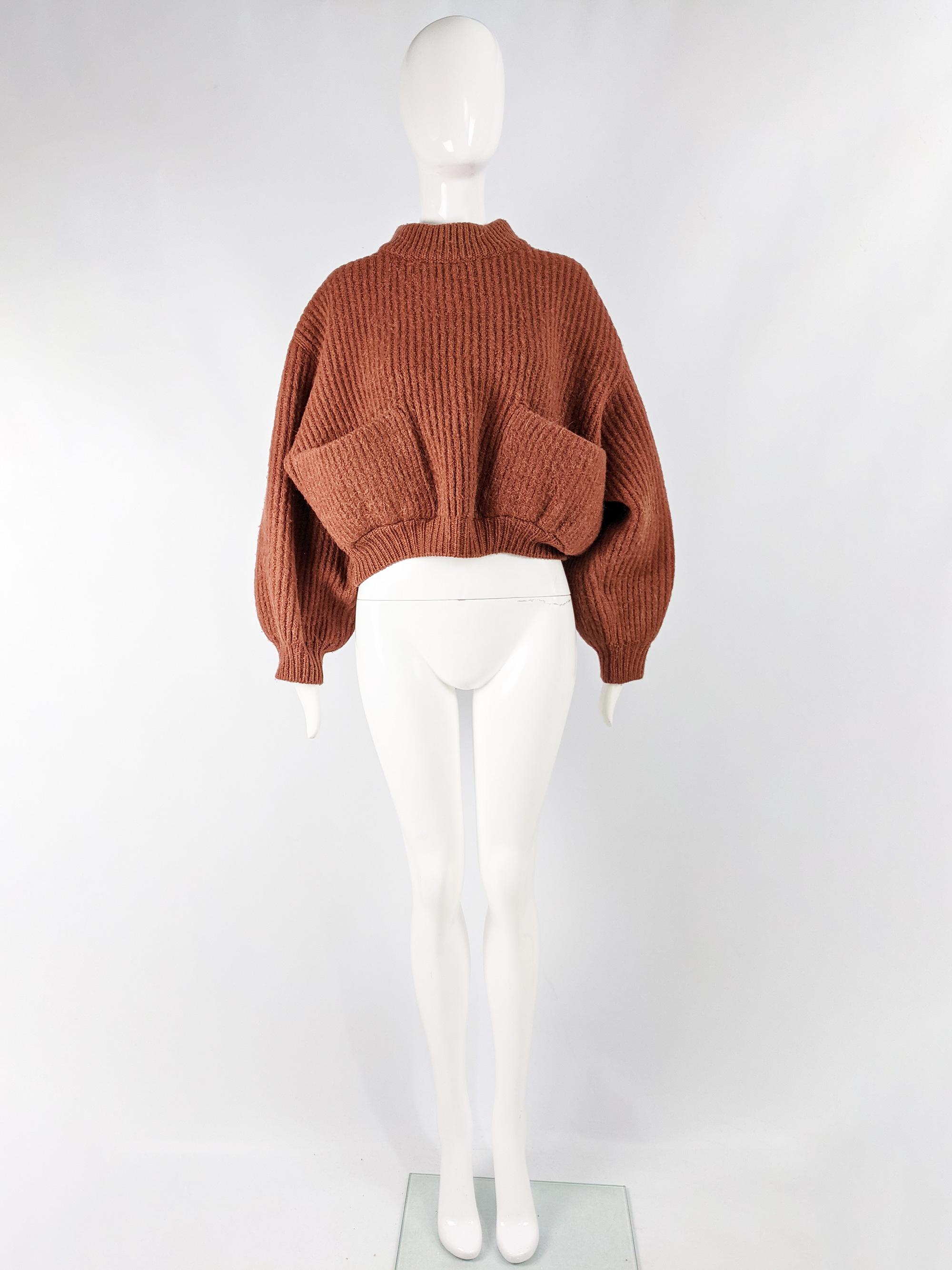 A rare and chic vintage womens Azzedine Alaia cropped jumper from the 1985 Autumn Winter collection. It has an amazing oversized and cropped fit with dropped shoulder seams and patch pockets.

Size: Unlabelled; One size fits most due to oversized
