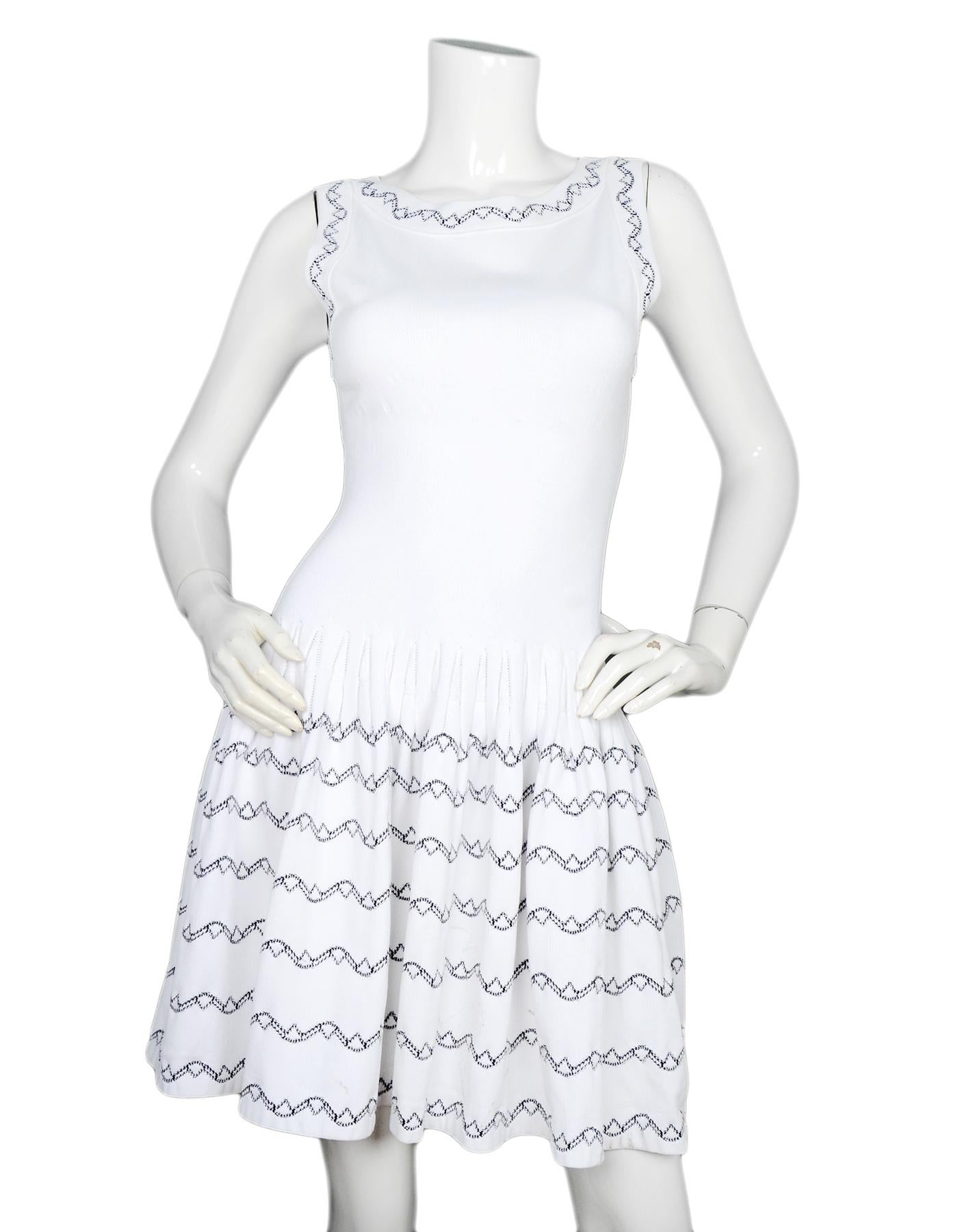 Alaia White Fit & Flare Sleeveless Dress W/ Black Embroidery Sz 40

Made In: Italy
Color: White, black
Materials: 85% viscose, 12% polyester, 3% cotton
Opening/Closure: Hidden back zip 
Overall Condition: Good pre-owned condition with excpetion of